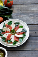 Caprese salad with pesto and balsamic vinegar