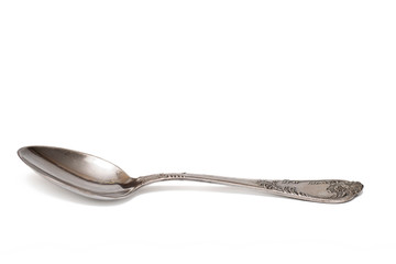 Antique spoon on white isolated background