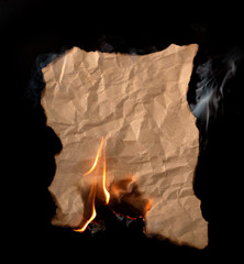 .burning piece of crumpled paper