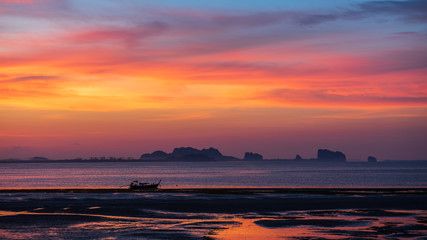 small boat in the sea with twilight sky in morning at koh mook, Trang province, Thailand