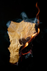 .burning piece of crumpled paper
