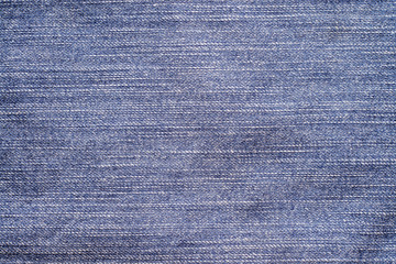 Close up of  blue denim jeans fabric texture background.