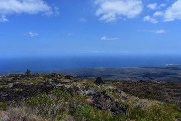 Old Lava field running into the sea sharp cliffs eroded over time from the crash of the surf