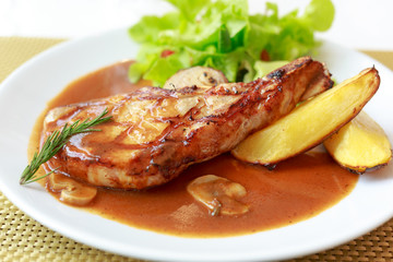 grilled pork chop with vegetable on disk