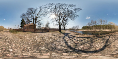full seamless spherical hdri panorama 360 degrees angle view on gravel road near brick house in...