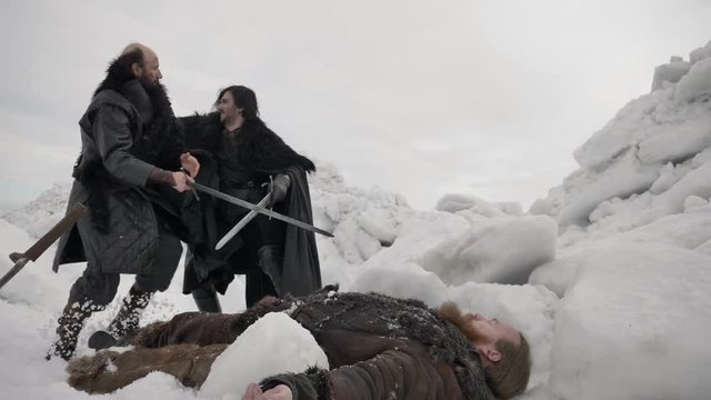 Battle scene. Viking defending his injured friend