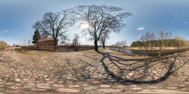 full seamless spherical hdri panorama 360 degrees angle view on gravel road near brick house in village near river in equirectangular projection, ready AR VR virtual reality content