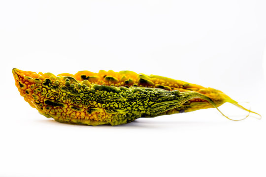 Close up of bitter gourd or bitter melon isolated on white.
