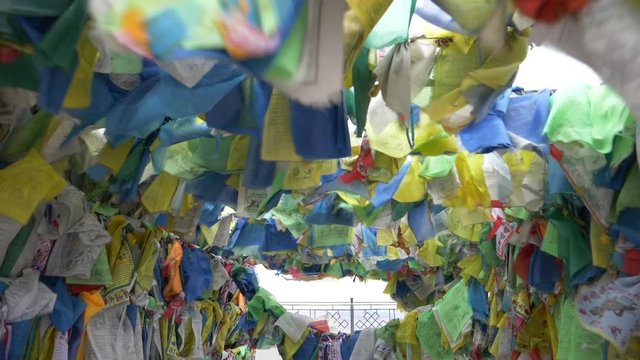 Colorful Tibetan prayer flags swaying in the wind in the temple, Ulan Ude Russia