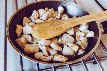 Fried chicken pieces on a pan