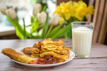 Breakfast with pancakes and milk