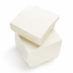 Pieces of Feta cheese on white