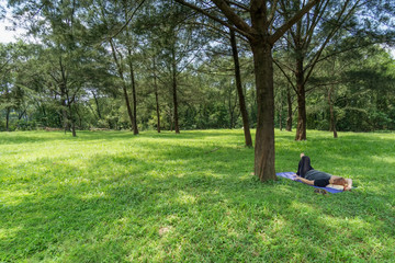 Woman Lying Down on Grass
