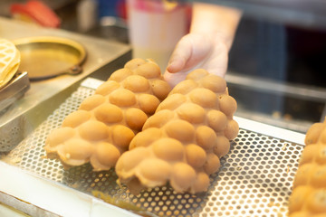 Street food in Hong Kong with famous desert Hong Kong waffle.