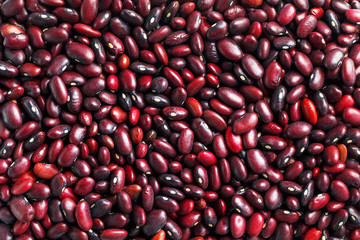 Closeup of a grain of red bean seeds. The texture of the legumes. Close up red beans background, seeds of red beans