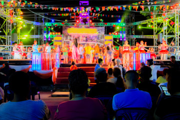 backside audient Thai music night concert dancing on stage.