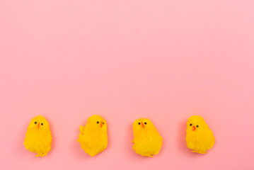 Easter holiday theme with little chick toys on pink background