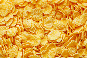 Golden cornflakes background and texture. View from above. cornflakes healthy breakfast