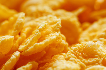 Golden cornflakes background and texture. View from above. cornflakes healthy breakfast, macro