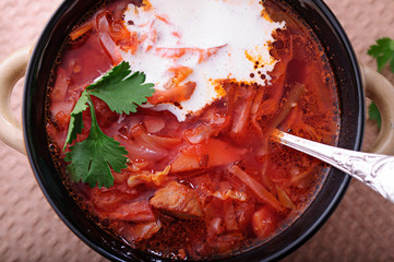 Aromatic soup with sour cream and black bread.
