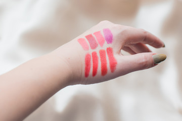 Matte lipstick for lips in different colors. Decorative cosmetics and summer - spring colors in makeup 