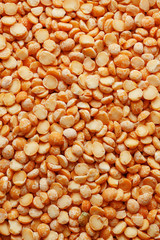 Background texture of pea porridge golden color in full-frame form. View from above. Close-up