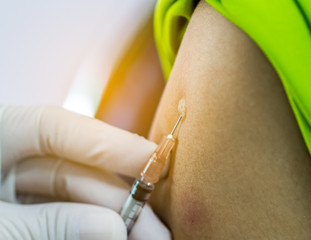 Hand of doctor inject vaccine solution in intradermal