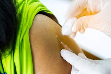 Hand of doctor inject vaccine solution in intradermal