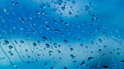 Rain Drops Relecting on Window Glass