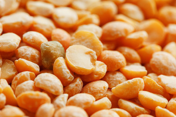 Background texture of pea porridge golden color in full-frame form. View from above. Close-up