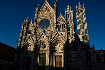 Siena’s cathedral facade detail. Medieval church famous landmark in Tuscany, Italy