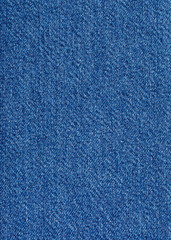 Beautiful blue denim fabric close up. Can be used as a background.