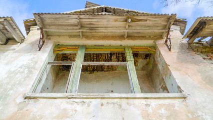 13328_The_old_window_from_the_damaged_house_in_Ukraine.jpg