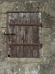 old wooden door with rusty bits
