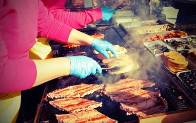 hot sausages on the grill during the village festival