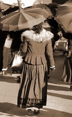 women dressed in vintage clothes and a umbrella
