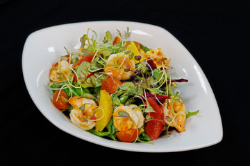asiatic style shrimps salad with citrus fruits and lettuce