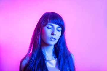 girl on a colored background in blue light