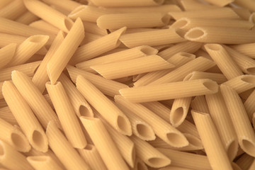 Close up of raw uncooked maccheroni pasta 