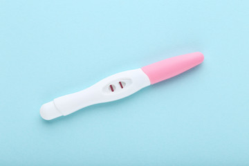 Pregnancy test on blue background