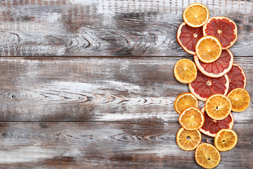 Dried citrus fruits on brown wooden table