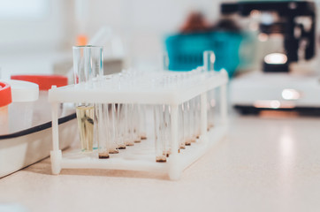 blood test tubes in a medical laboratory closeup blurred background. concept of healthcare 