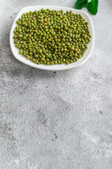 mung beans, mash. green beans in a white plate on the table. top food background. copy space