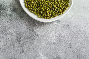 mung beans, mash. green beans in a white plate on the table. top food background. copy space