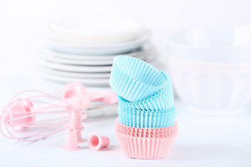 Colorful cupcake cases with kitchen utensils