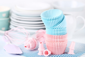Colorful cupcake cases with kitchen utensils
