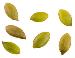 Pumpkin seeds isolated on white, top view.