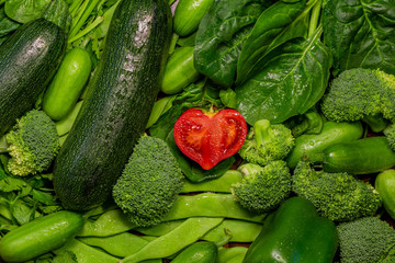 Heart shaped tomato. I love healthy food. Concept written with mix of green and red vegetables:...