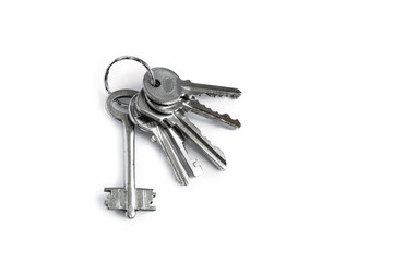 Several keys on a white isolated background,the keys to the apartment.