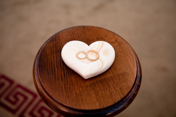 Gold wedding rings on stand for rings